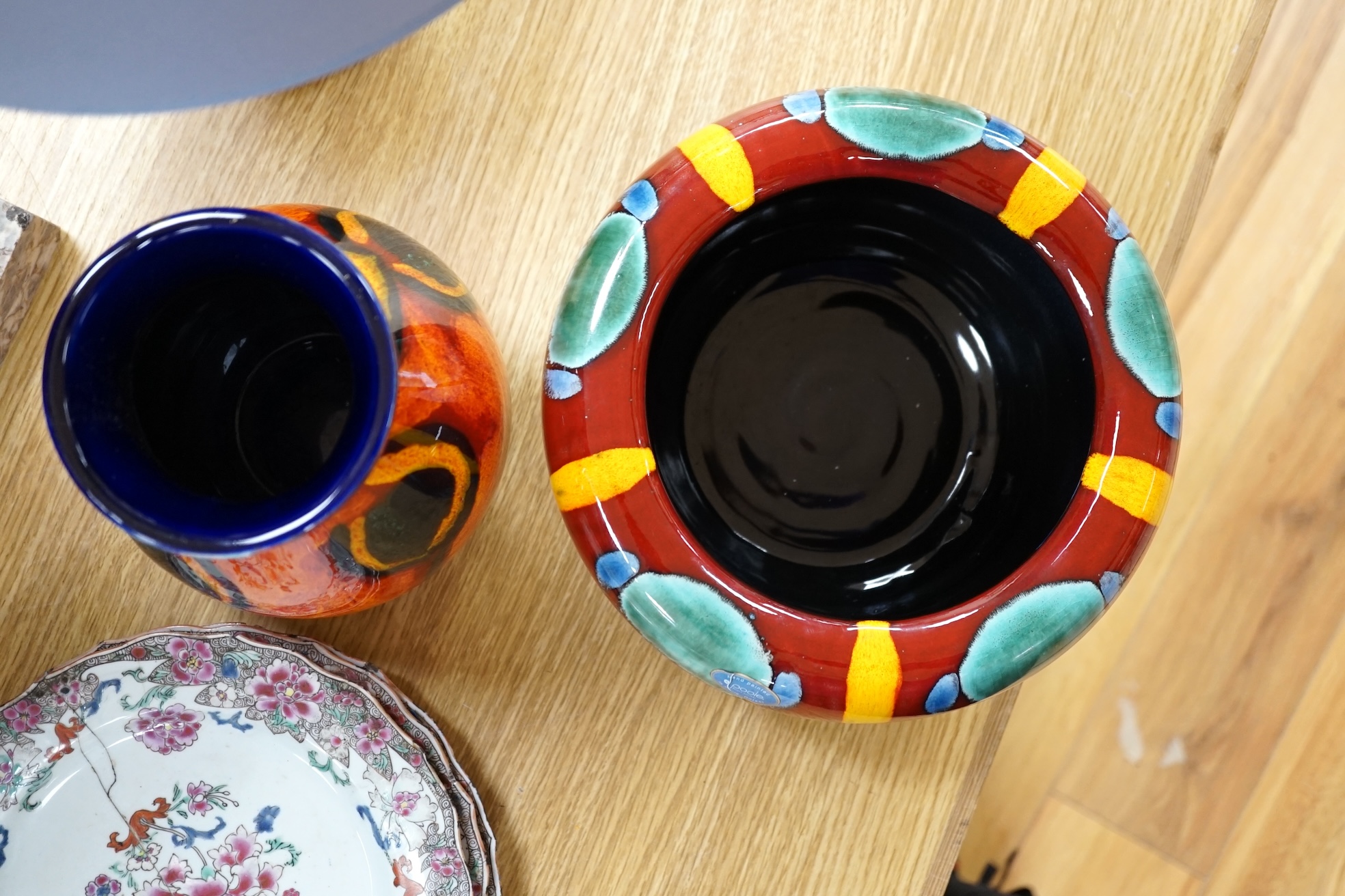 Three pieces of Poole pottery comprising Infusion concave bowl, a peacock design vase and a table lamp with shade, largest 51cm high. Condition - good